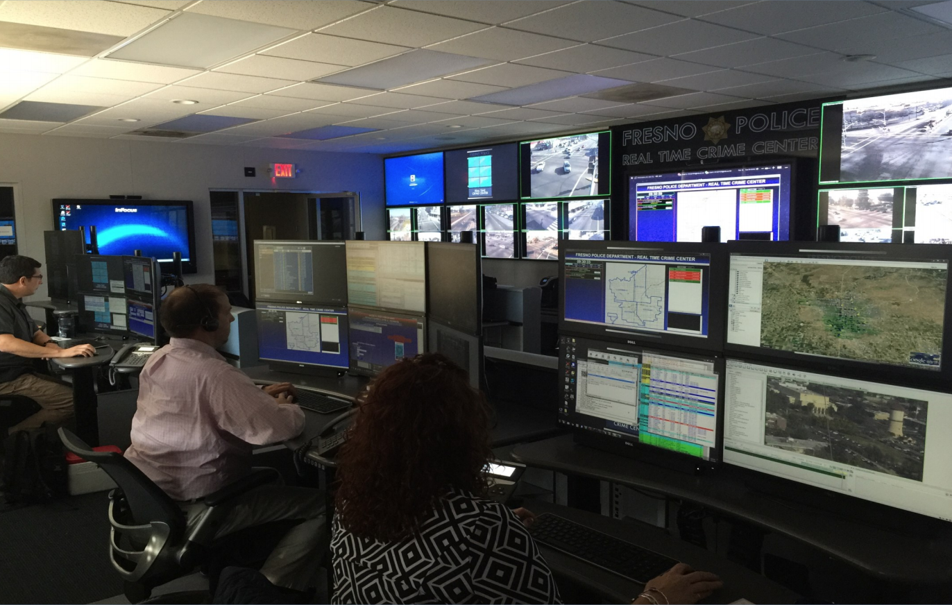 Room full of analysts looking at computer monitors