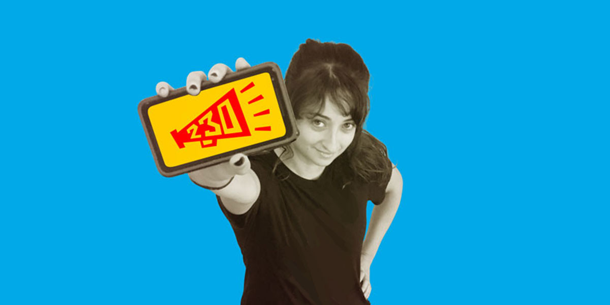 Stop SESTA Stop SESTA: Woman Holds Phone with 230 Free Speech Icon
