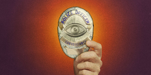 A hand holds up a police badge with spying eye
