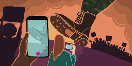 Protesters record on their phones as a massive boot positions to crush.